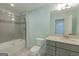 Modern bathroom with tiled shower/tub, gray vanity with white countertop, and a toilet at 319 Beaconsfield Dr, Sharpsburg, GA 30277