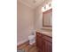 A well-lit bathroom showcases a granite countertop vanity at 319 Beaconsfield Dr, Sharpsburg, GA 30277