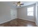 Cozy bedroom with hardwood floors, neutral colors and a ceiling fan at 319 Beaconsfield Dr, Sharpsburg, GA 30277