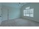 Spacious bedroom with carpet floors, ceiling fan, closet, and bright window at 319 Beaconsfield Dr, Sharpsburg, GA 30277