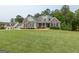 Inviting two-story home with a well-maintained lawn and mature trees in a desirable neighborhood at 319 Beaconsfield Dr, Sharpsburg, GA 30277