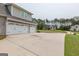 Spacious three-car garage with ample parking and a well-kept exterior at 319 Beaconsfield Dr, Sharpsburg, GA 30277