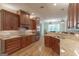 Gourmet kitchen with custom cabinets, granite countertops, and modern stainless steel appliances at 319 Beaconsfield Dr, Sharpsburg, GA 30277