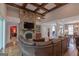 Living room featuring a stone fireplace, wood floors, and a large sectional sofa at 319 Beaconsfield Dr, Sharpsburg, GA 30277