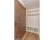 Mudroom with custom-built shelving and a sliding barn door at 319 Beaconsfield Dr, Sharpsburg, GA 30277
