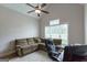 Cozy home office with a comfortable seating area and natural light at 319 Beaconsfield Dr, Sharpsburg, GA 30277