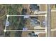 Aerial view of property boundaries shows lot size and landscaping with surrounding homes at 319 Beaconsfield Dr, Sharpsburg, GA 30277