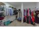 Well-organized walk-in closet with ample storage shelves and clothing racks at 319 Beaconsfield Dr, Sharpsburg, GA 30277
