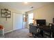 Cozy bedroom with carpet, closet, desk, and window offering ample natural light at 701 Monticello Ln, Mcdonough, GA 30253