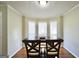 Cozy dining room with a bay window, perfect for Gathering meals at 701 Monticello Ln, Mcdonough, GA 30253
