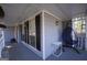 Relaxing covered front porch with seating area and view of the neighborhood at 701 Monticello Ln, Mcdonough, GA 30253