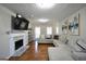 Inviting living room with a fireplace, hardwood floors, and ample seating at 701 Monticello Ln, Mcdonough, GA 30253