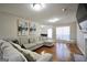 Spacious living room featuring a comfortable seating area and hardwood floors at 701 Monticello Ln, Mcdonough, GA 30253