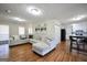 Open concept living area with hardwood floors, seamlessly flowing into the kitchen at 701 Monticello Ln, Mcdonough, GA 30253