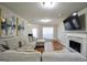 Comfortable living room with a fireplace and hardwood floors at 701 Monticello Ln, Mcdonough, GA 30253