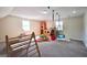 Spacious playroom featuring a climbing wall, swings and castle at 701 Monticello Ln, Mcdonough, GA 30253
