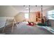 Spacious playroom featuring a climbing wall, swings and castle at 701 Monticello Ln, Mcdonough, GA 30253