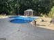 Inviting in-ground pool featuring a gazebo, a spa and a spacious patio area perfect for outdoor relaxation at 624 Kristen Ct, Mcdonough, GA 30252
