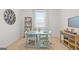 This home office features a large desk, wood accent furniture, and neutral walls at 147 Oakchase Park Ln, Hampton, GA 30228