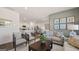 Open concept living room and kitchen area with modern furnishings and decor at 147 Oakchase Park Ln, Hampton, GA 30228