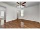 Bedroom with hardwood floors featuring ceiling fan, natural light and access to bath at 203 First Leaf, Peachtree City, GA 30269