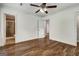 Primary bedroom with hardwood floors features connecting bath with updated countertops at 203 First Leaf, Peachtree City, GA 30269