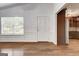 View of a bright living room featuring hardwood floors and decorative trim at 203 First Leaf, Peachtree City, GA 30269