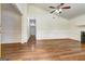 Spacious living room with hardwood floors, high ceilings, and elegant trim at 203 First Leaf, Peachtree City, GA 30269