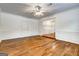 This living room provides beautiful hardwood floors and detailed trim at 203 First Leaf, Peachtree City, GA 30269