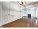 Open-concept living space showcases beautiful hardwood floors and easy access to the kitchen at 203 First Leaf, Peachtree City, GA 30269