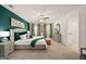Serene main bedroom with stylish furniture, soft carpet, and a neutral color palette creating a relaxing retreat at 628 Whitman Ln, Stockbridge, GA 30281