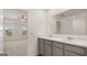 Modern bathroom with double vanity, marble countertop, and gray cabinets at 636 Whitman Ln # 2035, Stockbridge, GA 30281