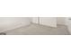 Bedroom with plush carpeting and white doors leading to closet space at 636 Whitman Ln # 2035, Stockbridge, GA 30281