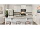 Modern kitchen features white cabinets, stainless steel appliances, and a marble countertop at 636 Whitman Ln # 2035, Stockbridge, GA 30281