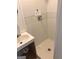 Bright bathroom featuring a tile shower and sink with a chrome faucet at 8832 Twin Oaks Dr, Jonesboro, GA 30236