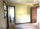 Bedroom with doorway to bathroom at 8832 Twin Oaks Dr, Jonesboro, GA 30236