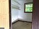 Empty closet with white shelves at 8832 Twin Oaks Dr, Jonesboro, GA 30236