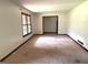 Living room featuring large window and access to other rooms at 8832 Twin Oaks Dr, Jonesboro, GA 30236