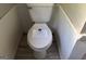 Close up view of toilet in a bathroom with a white tank at 8832 Twin Oaks Dr, Jonesboro, GA 30236