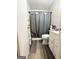 Bathroom with tiled shower and vanity sink at 3683 Miller St, Lithia Springs, GA 30122
