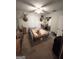 Bedroom with deer heads mounted on the wall, double bed, ceiling fan, and carpeted floors at 3683 Miller St, Lithia Springs, GA 30122