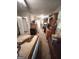Angle view of a bedroom with double bed, carpet, ceiling fan, and doorway leading to another room at 3683 Miller St, Lithia Springs, GA 30122