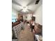 View of a furnished bedroom with beige carpet, ceiling fan, and lots of furnishings at 3683 Miller St, Lithia Springs, GA 30122