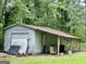 Outdoor garage, great for working on cars, storage, or a workshop at 3683 Miller St, Lithia Springs, GA 30122