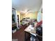 Eat-in kitchen with tile countertops, hardwood floor, and yellow cabinets at 3683 Miller St, Lithia Springs, GA 30122
