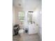 Clean bathroom with a white vanity and tile floors, offering a functional and well-maintained space at 10 Stagg Trce, Social Circle, GA 30025