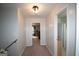 Hallway featuring neutral walls and carpet, leading to bedroom and bathroom areas at 10 Stagg Trce, Social Circle, GA 30025