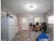 This kitchen features a refrigerator, and a view of a work space and bedroom at 10 Stagg Trce, Social Circle, GA 30025