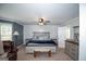 Spacious primary bedroom with fan, and sitting area with natural light at 10 Stagg Trce, Social Circle, GA 30025