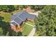 Beautiful brick home with mature landscaping, lush lawn, and a charming walkway at 1000 Turner Church Rd, Mcdonough, GA 30252